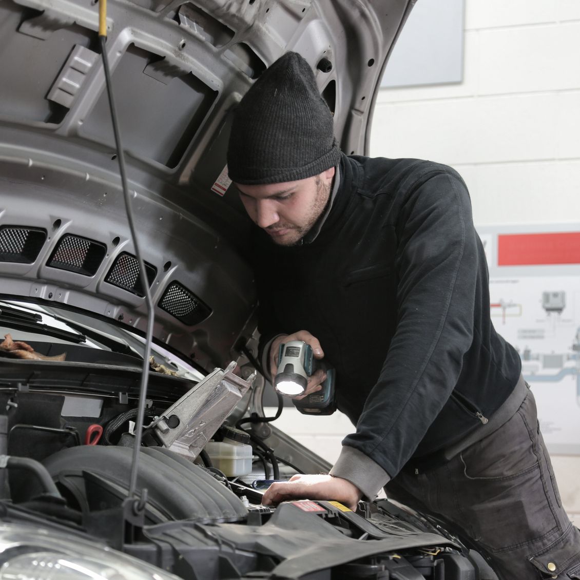 man checking engine