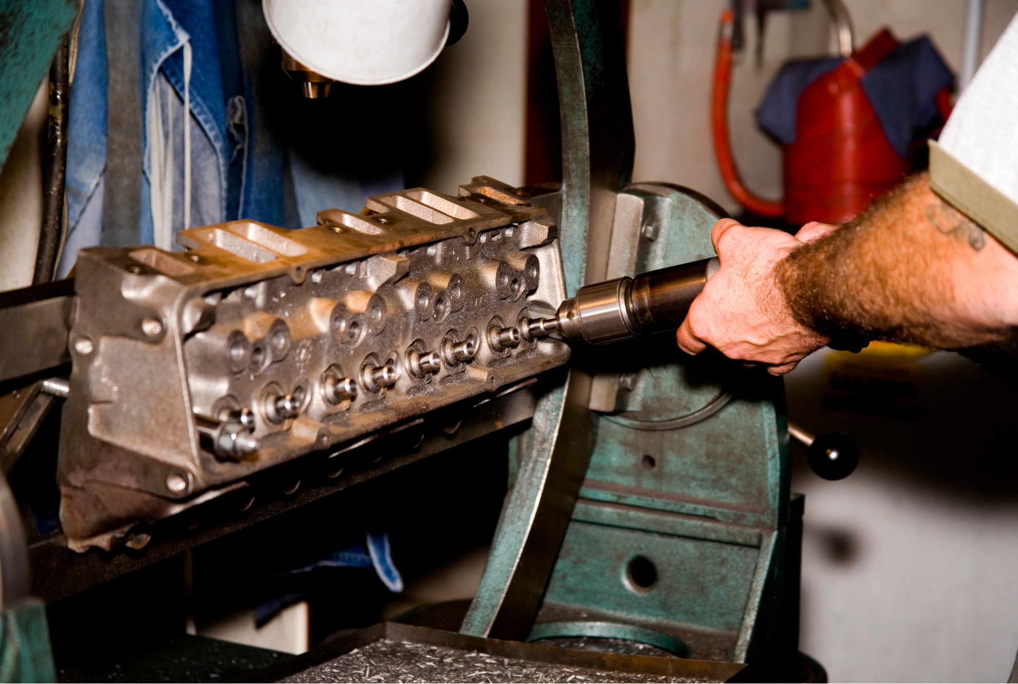 man repairing cylinder heads