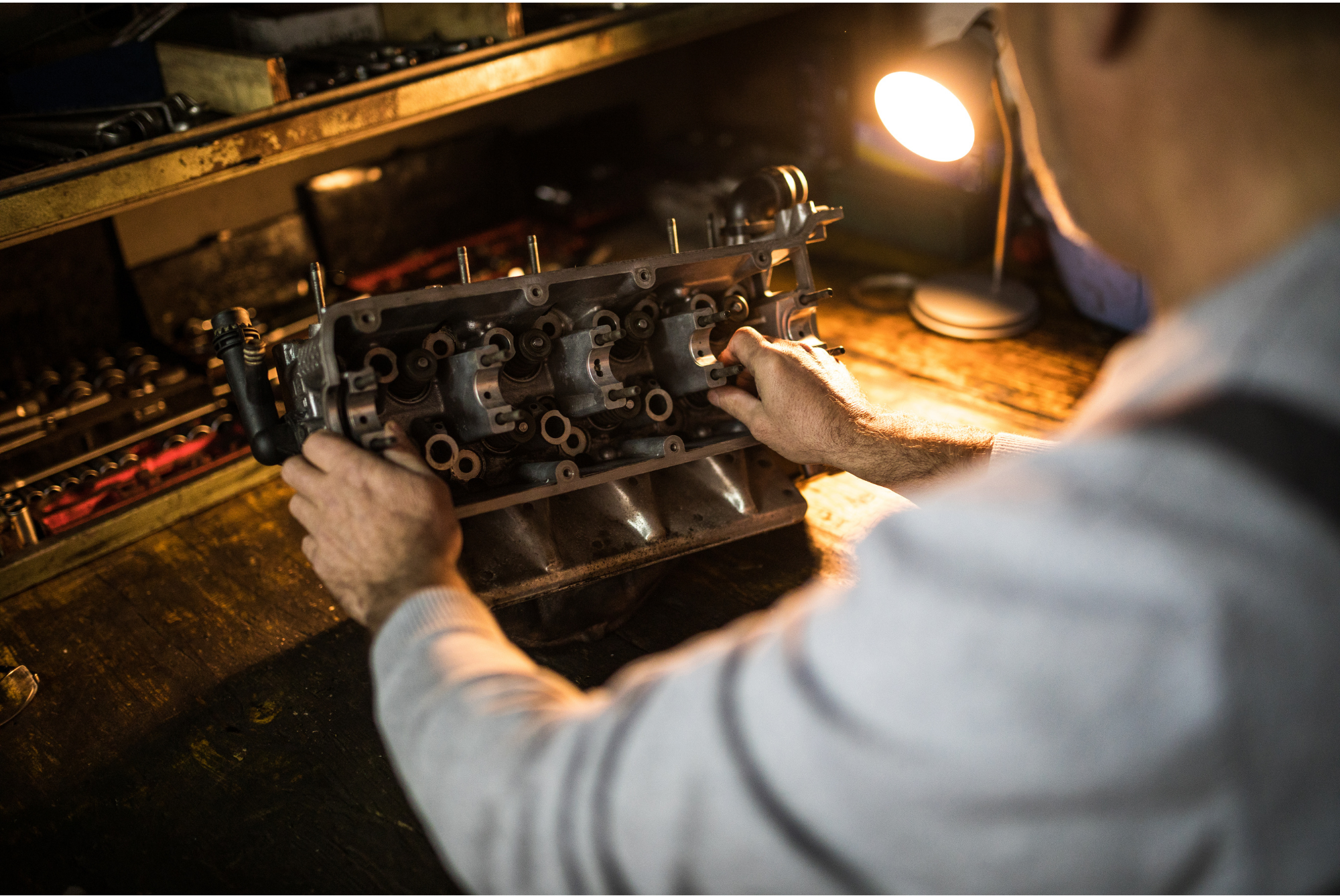 man checking cylinder heads